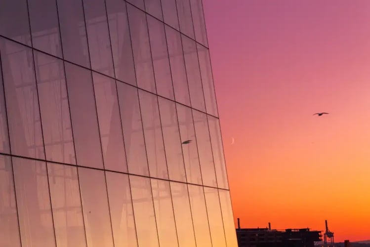 glass-wall-of-oslo-opera-house-in-oslo-at-sunset-2026-03-25-00-21-42-utc